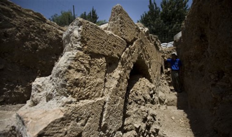 Israeli archaeologist Yehiel Zelinger shows a section of the 14th-century aqueduct near Jerusalem's Old City on Tuesday.